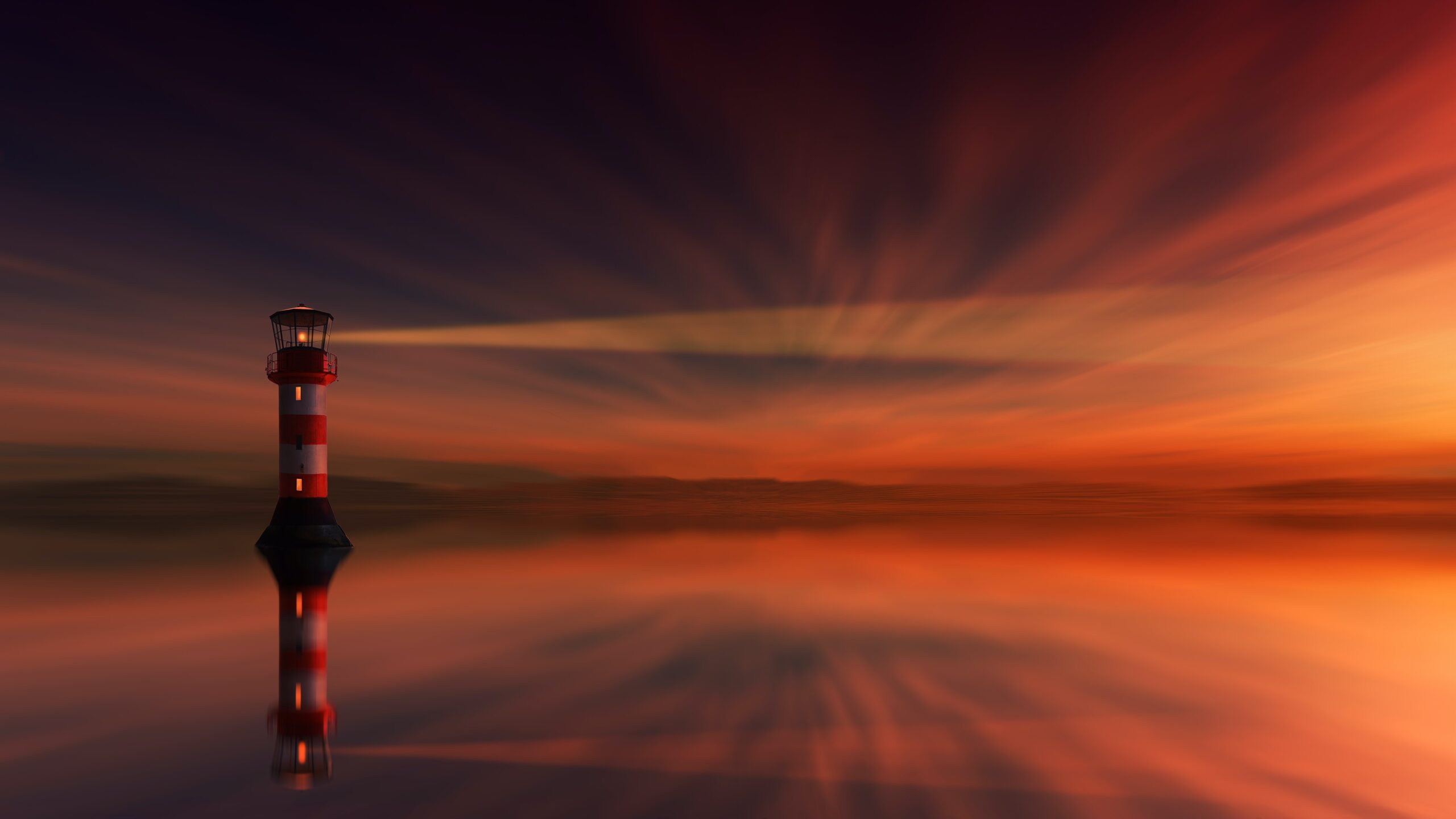 Lighthouse at night, bathed in orange light